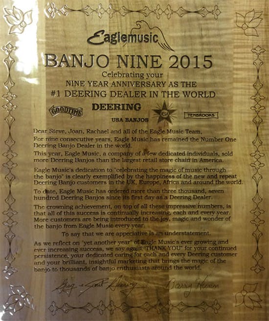 Deering present Eagle Music with None Year Annsiversary plaque